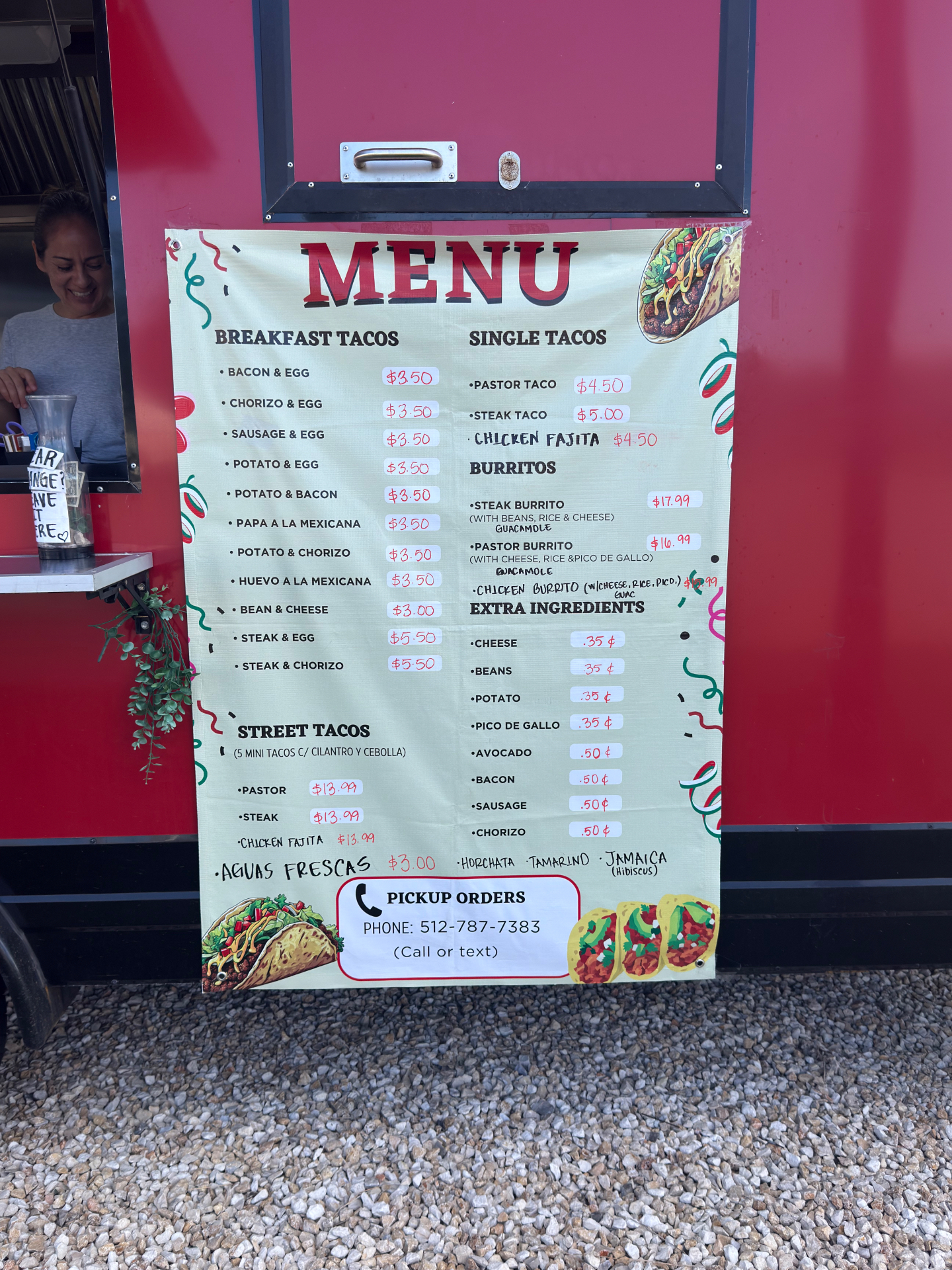Taco Rapido GTX menu board — breakfast tacos, single tacos, burritos, street tacos, aguas frescas, and extras with prices.